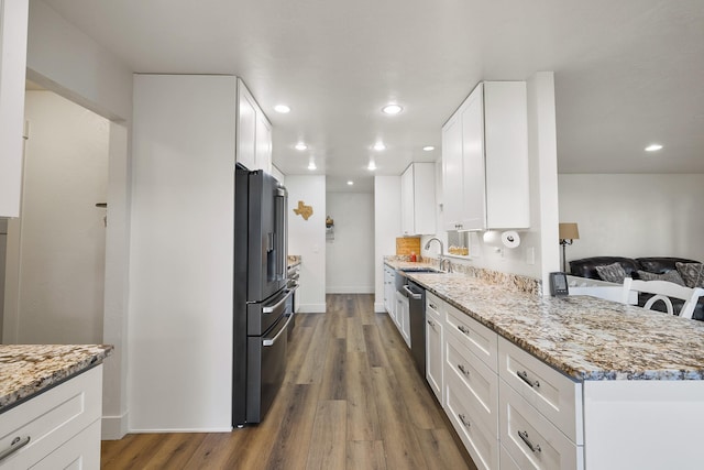 1323 E Deerhaven Ave Dalton Gardens, Dalton Gardens, Coeur D Alene, ID 83815 - kitchen featuring light stone countertops, high end refrigerator, white cabinetry, and hardwood / wood-style floors