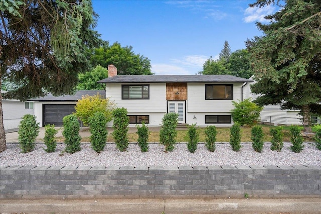 split foyer home featuring a garage