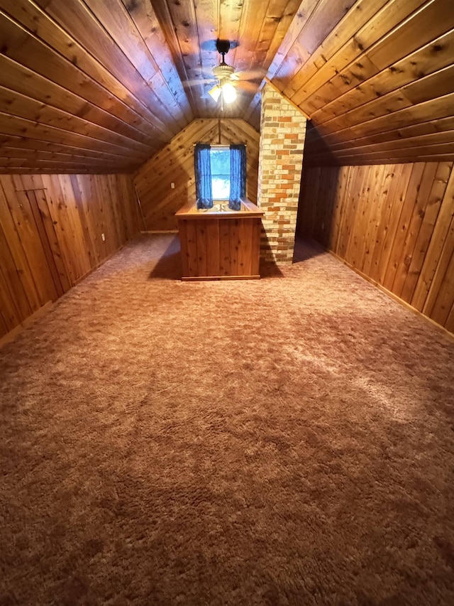 additional living space featuring wooden walls, carpet flooring, lofted ceiling, and wood ceiling