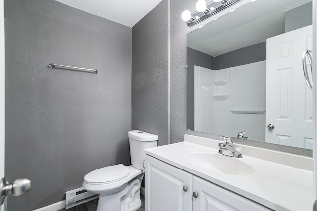 bathroom with vanity, a baseboard radiator, toilet, and walk in shower