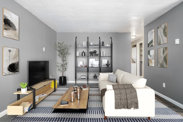 living room with dark hardwood / wood-style floors