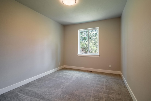 empty room featuring carpet flooring