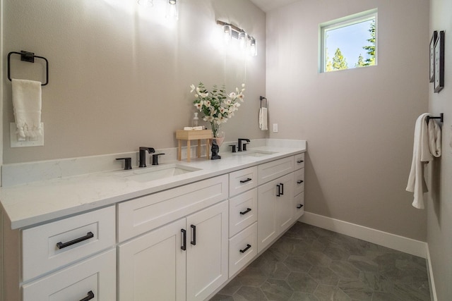 bathroom with tile patterned flooring and vanity