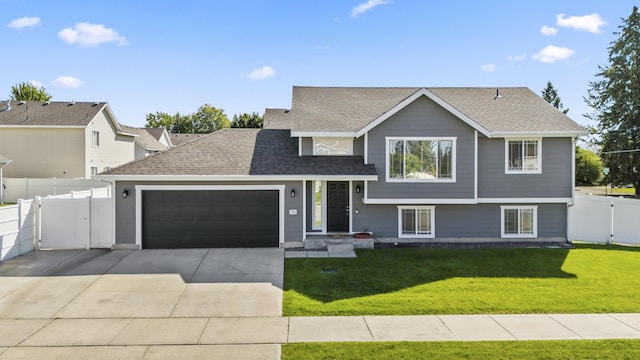 view of front facade with a front lawn and a garage