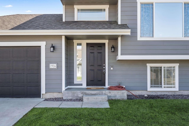 doorway to property featuring a garage