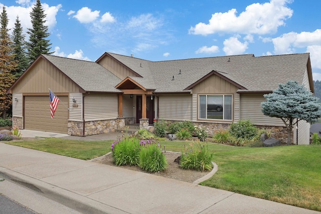 view of front facade with a front yard and a garage