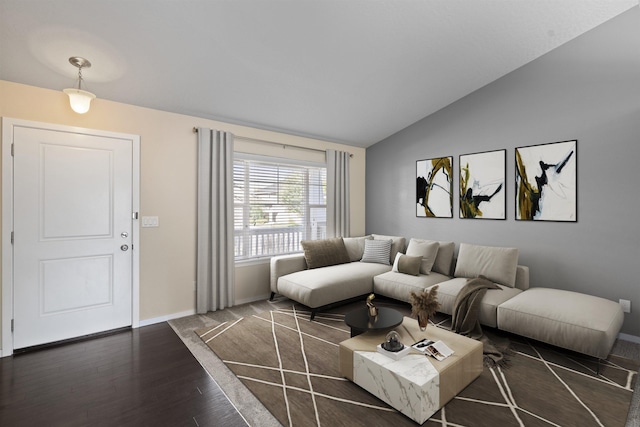 living room featuring dark hardwood / wood-style floors and vaulted ceiling