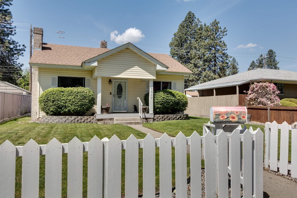 bungalow with a front lawn