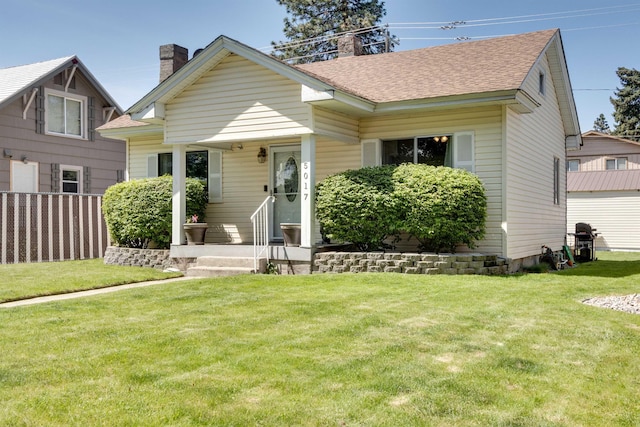 view of front of home with a front lawn