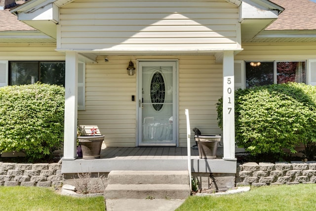 view of exterior entry featuring a porch