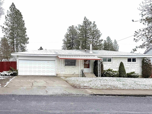 ranch-style home with a garage