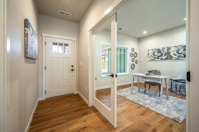 doorway to outside featuring wood-type flooring