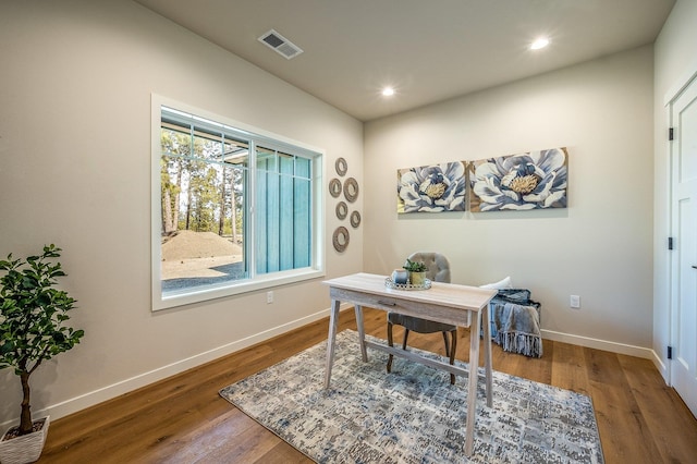 home office with hardwood / wood-style flooring