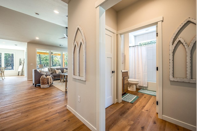 hallway with light wood-type flooring