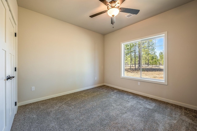 empty room with carpet floors and ceiling fan