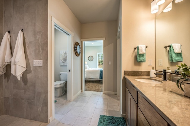 bathroom featuring tile patterned floors, vanity, and toilet