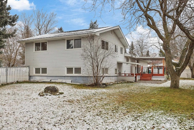 view of side of home featuring a lawn and a wooden deck