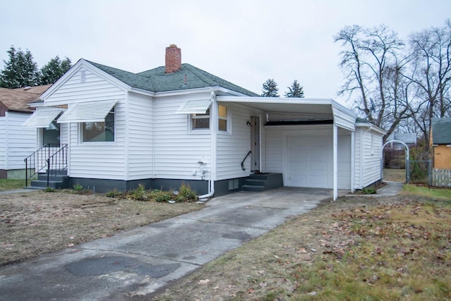 rear view of property with a carport