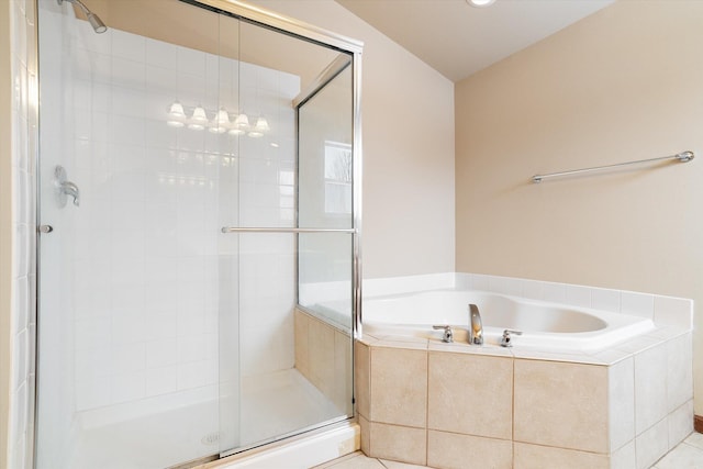 bathroom featuring tile patterned flooring and separate shower and tub