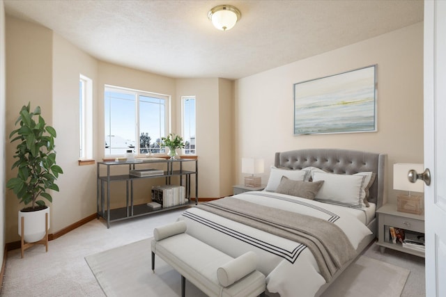 bedroom featuring light colored carpet