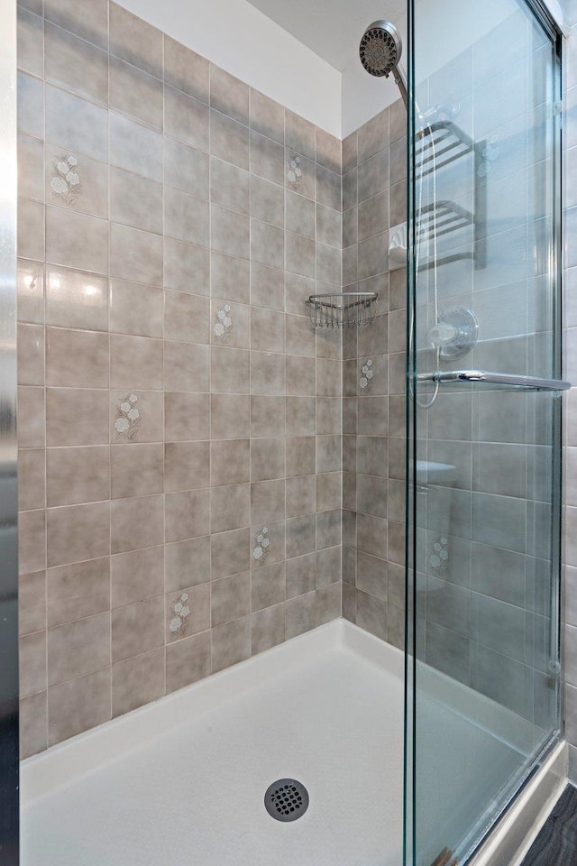 bathroom featuring an enclosed shower