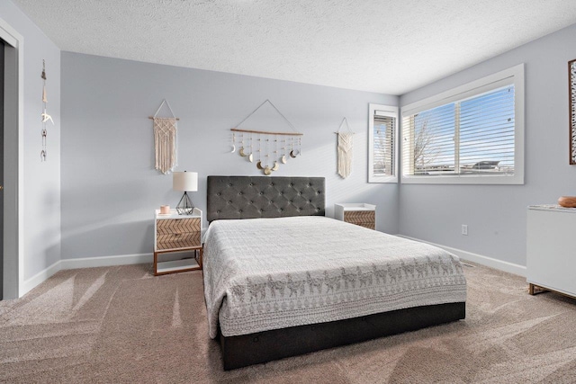 bedroom with carpet flooring and a textured ceiling