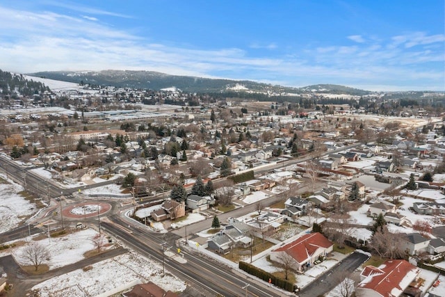 snowy aerial view featuring a mountain view