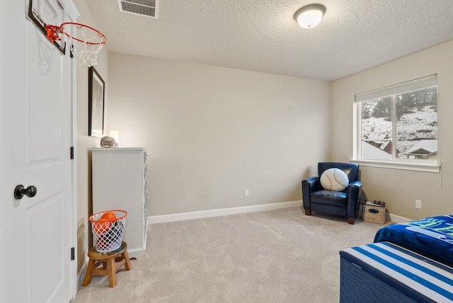 carpeted bedroom featuring a textured ceiling