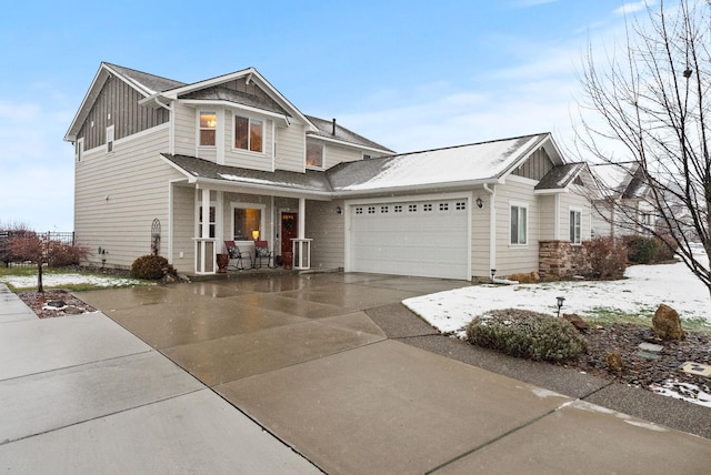 craftsman-style house featuring covered porch and a garage