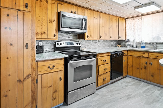 kitchen featuring backsplash, sink, and stainless steel appliances