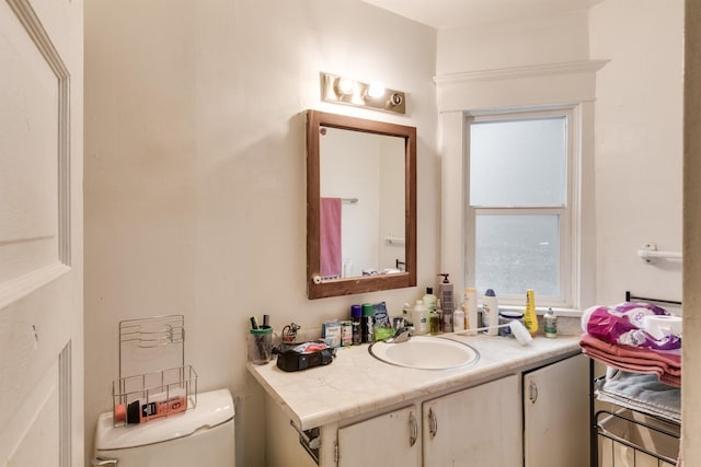 bathroom with vanity and toilet