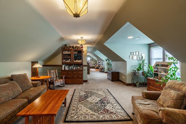 living room featuring light colored carpet and vaulted ceiling