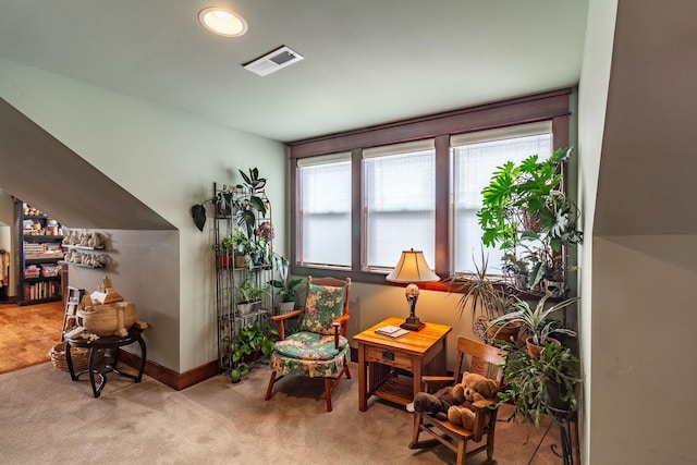 living area with light colored carpet