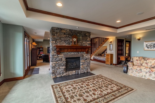 carpeted living room featuring a stone fireplace and ornamental molding