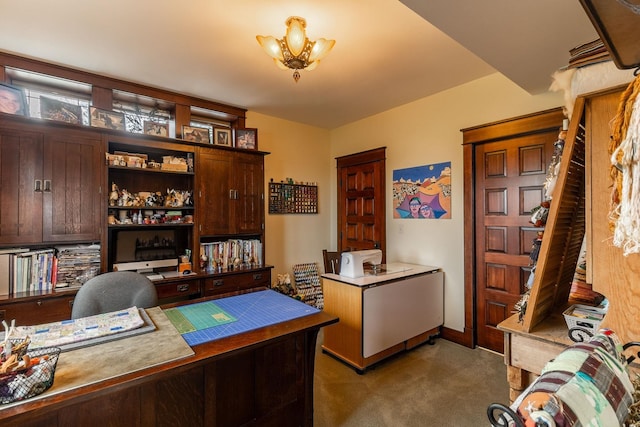 carpeted office with a notable chandelier