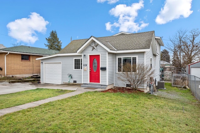 view of front of property with a front lawn, central AC unit, and a garage