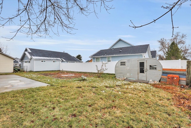 view of yard with an outdoor structure and a patio