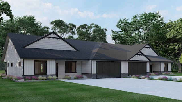 view of front of home featuring a garage and a front yard