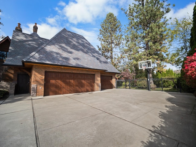 view of side of property with a garage