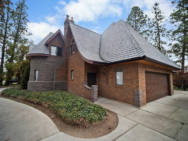 view of side of home with a garage