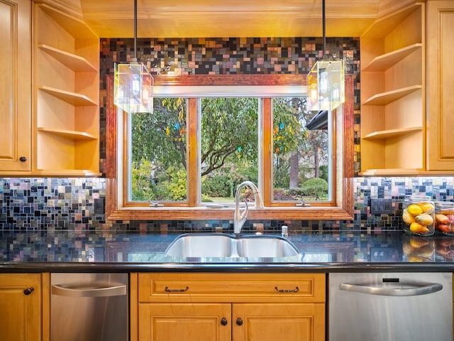 kitchen featuring dishwasher, pendant lighting, and sink