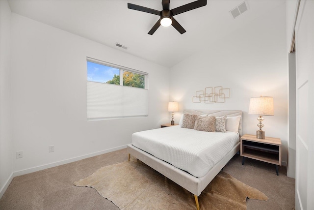 carpeted bedroom with ceiling fan and lofted ceiling