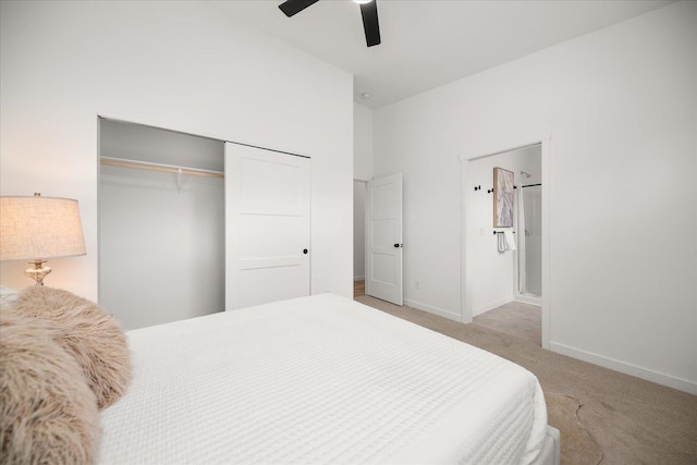 bedroom with ceiling fan, a closet, and light colored carpet