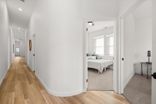 corridor featuring light hardwood / wood-style floors