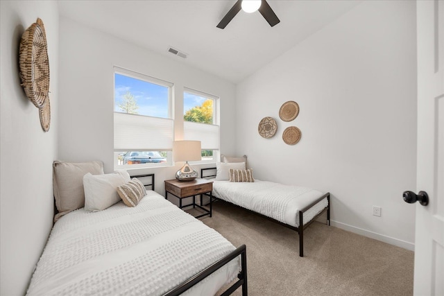 carpeted bedroom with ceiling fan and lofted ceiling