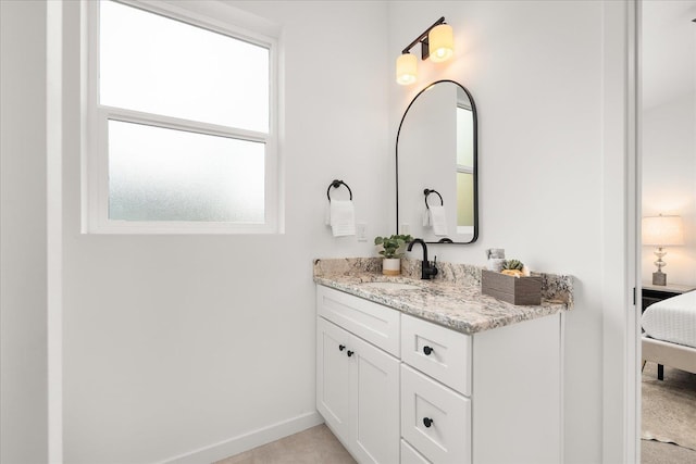 bathroom with vanity and a healthy amount of sunlight