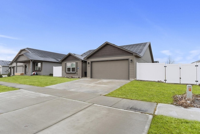 ranch-style home with a garage and a front lawn