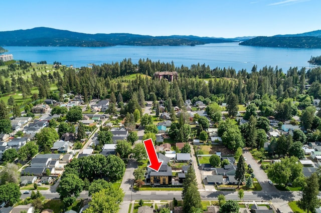 bird's eye view with a water and mountain view