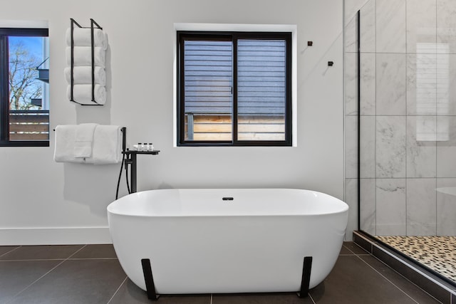 bathroom with separate shower and tub, tile patterned floors, and plenty of natural light