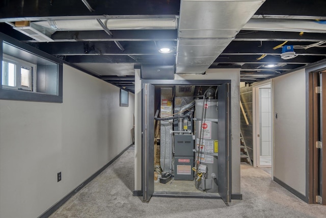 basement featuring carpet and gas water heater